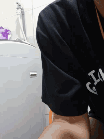 a person wearing a black shirt that says ' i 'm ' on it