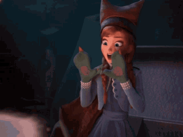 a girl in a fox hat is holding a snake in her hands