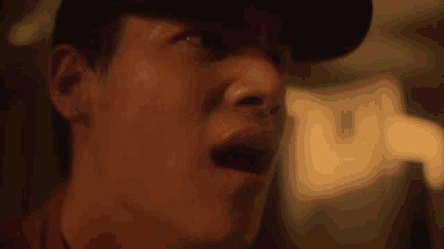 a close up of a man with his mouth open