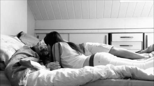 Kissing In Bed GIF - Kissing In Bed Couple GIFs