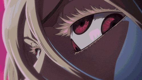a close up of a woman 's eye with red and white irises