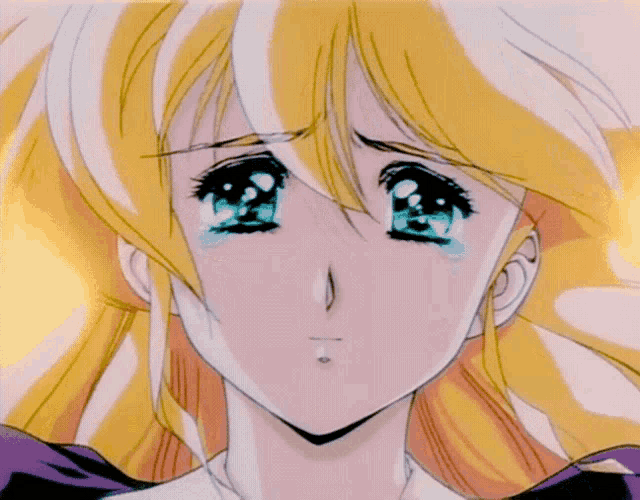a close up of a girl 's face with tears running down her face