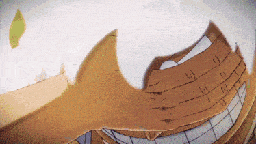 a close up of a cartoon character 's face with a few letters visible