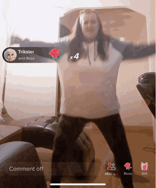a woman is dancing in front of a rose that trickster sent