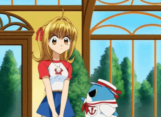 a girl in a red and white shirt stands next to a shark in a sailor suit