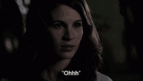 a close up of a woman 's face with the words " ohhh " in white letters