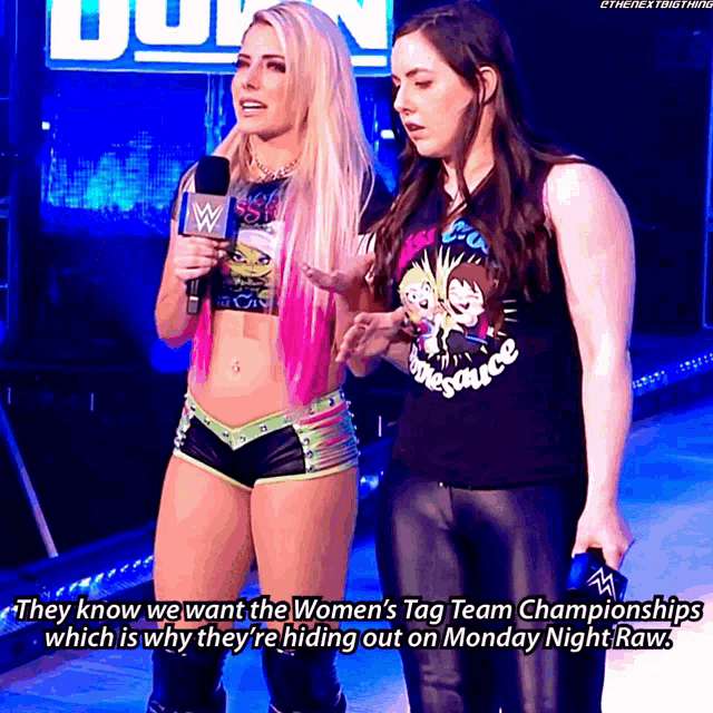 two women standing next to each other with the words " they know we want the women 's tag team championships " written below