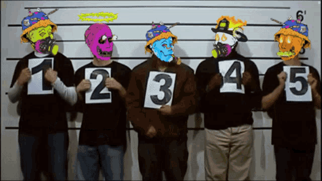 a group of people holding up signs with numbers 1 2 3 4 and 5 on them