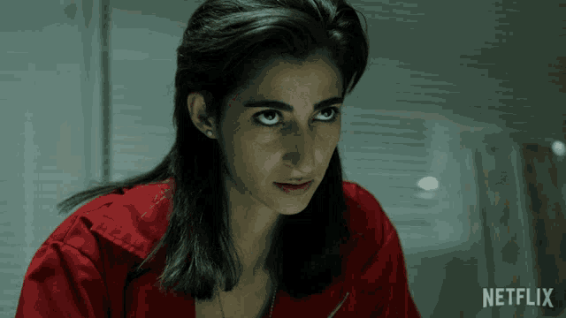 a woman in a red shirt with netflix on the bottom
