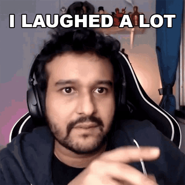 a man wearing headphones has the words i laughed a lot above his head