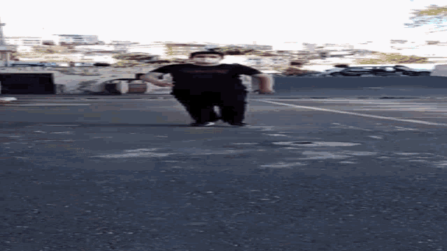 a man wearing a mask is walking down a road