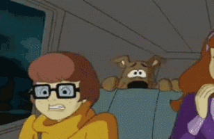 scooby doo and daisy are sitting in a car with a dog