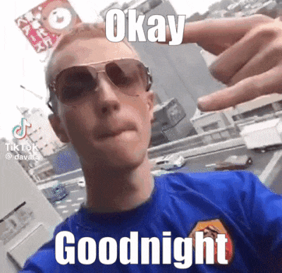 a man wearing sunglasses and a blue shirt is taking a selfie and says `` goodnight '' .