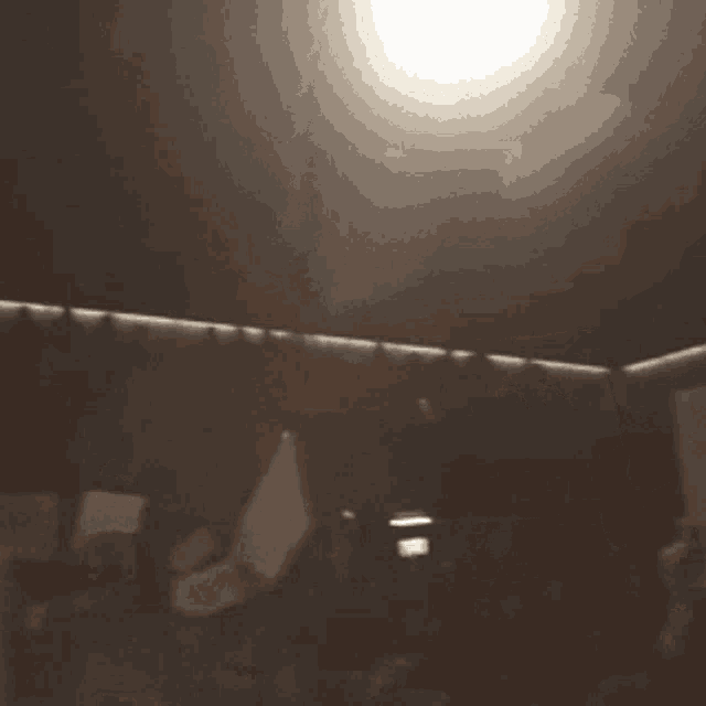 a blurred image of a room with a light on the ceiling