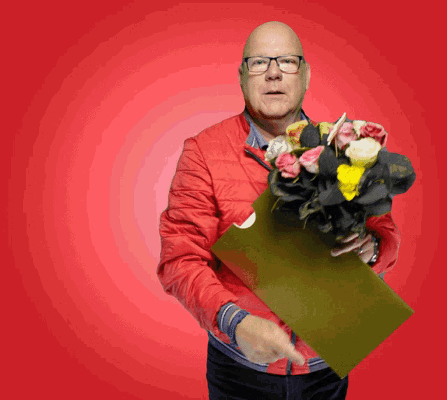 a man in a red jacket is holding a bouquet of flowers and pointing