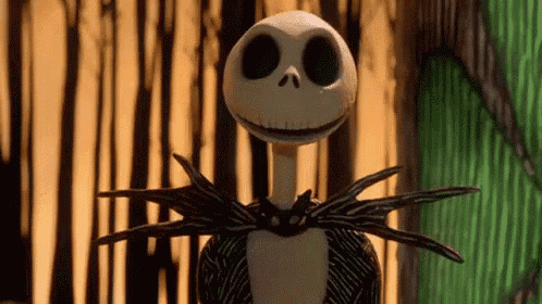 jack skellington from the nightmare before christmas is standing in front of a forest .