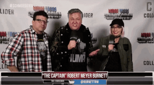 a group of people standing in front of a wall that says ' the captain robert meyer burnett '