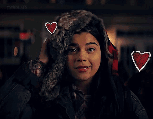 a woman wearing a fur hat with hearts drawn on her head