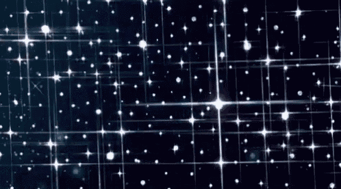 a bunch of stars are flying in the night sky