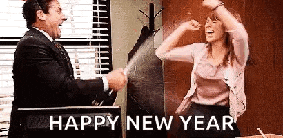a man and a woman are celebrating a new year in an office .