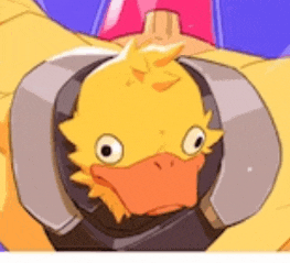 a close up of a yellow duck wearing headphones and a helmet .