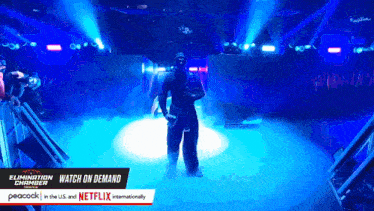 a peacock ad for the elimination chamber shows a wrestler on stage