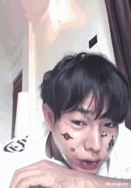 a close up of a person 's face with the name thisisakate visible