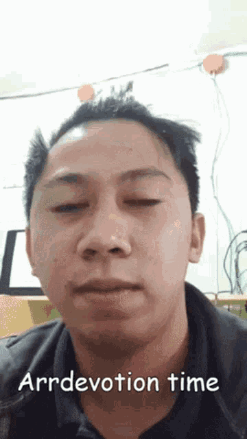 a close up of a man 's face with the words arr devotion time written below him