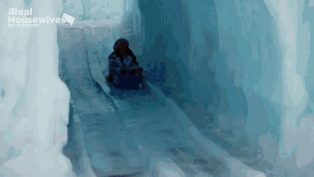 a real housewives advertisement shows a person sledding down a snow slope