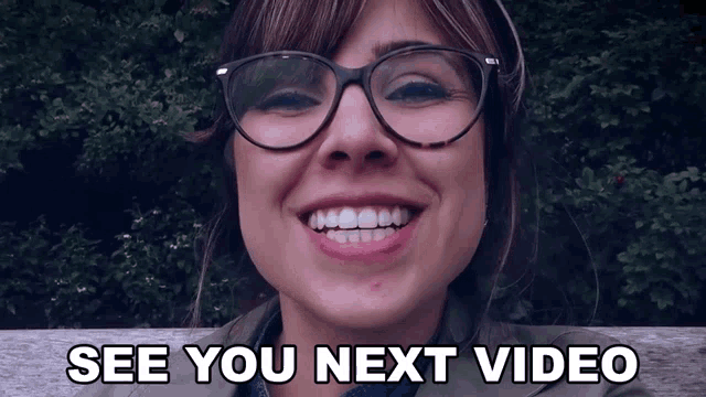 a woman wearing glasses is smiling with the words " see you next video " below her