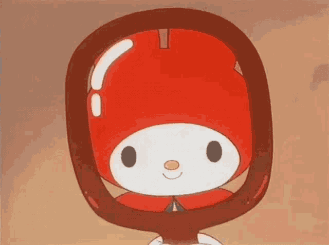 a cartoon character is looking at himself in a mirror and smiling .