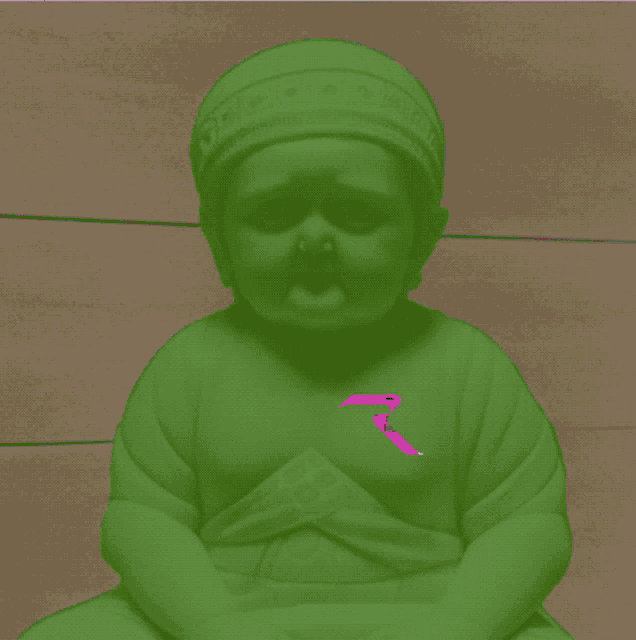 a statue of a child with a pink letter r on the chest