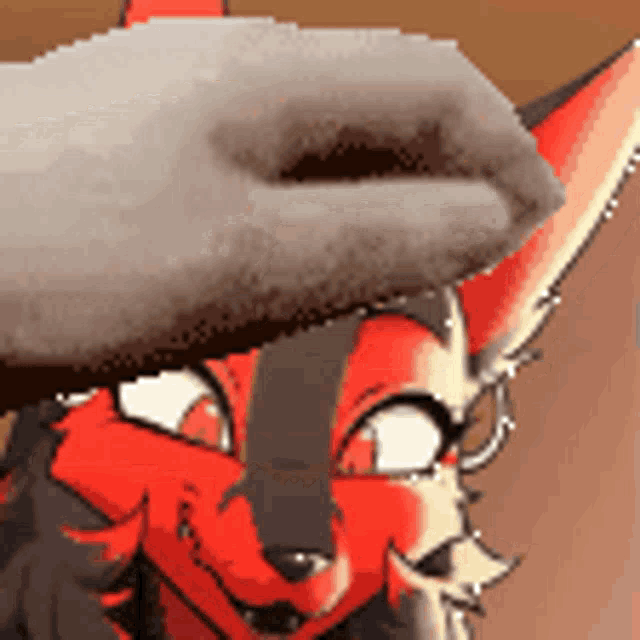 a close up of a cartoon character 's face with a hand holding it .