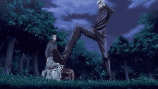 a man is kicking another man in the face in a park