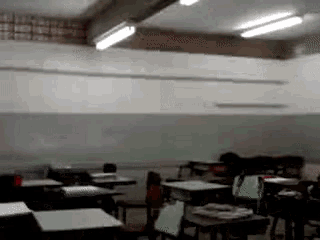 a classroom with lots of desks and chairs