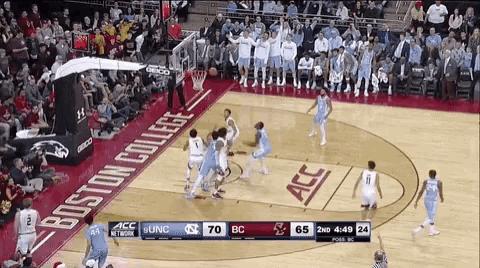 a basketball game is being played on a court that says boston college