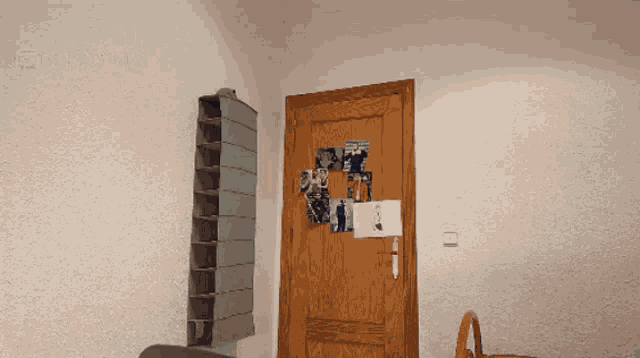 a room with a wooden door and a shelf on the wall with a sticker on it that says " i love you "