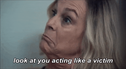 a woman making a face with the words look at you acting like a victim