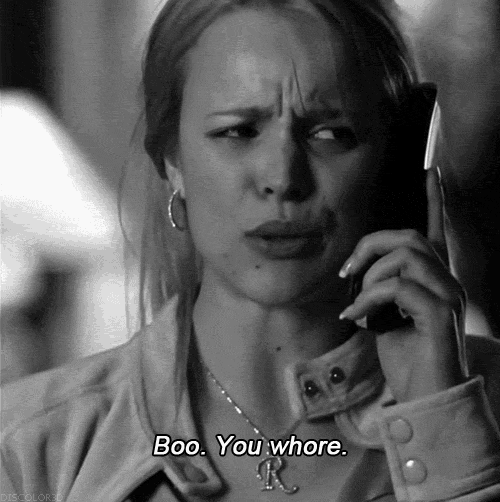 a woman talking on a cell phone with the words boo you whore on the bottom