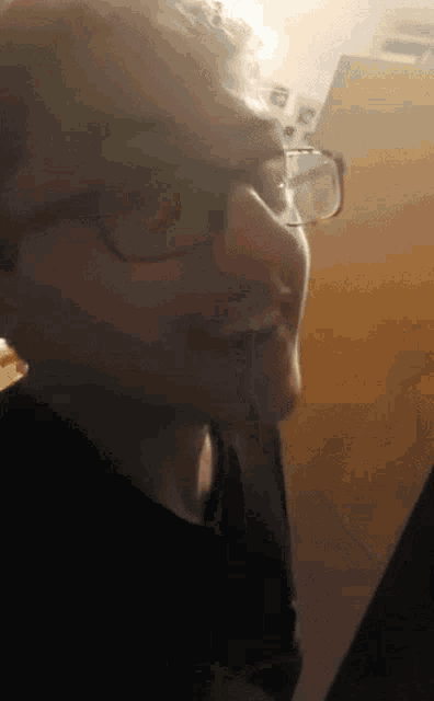 a close up of a person wearing glasses