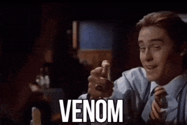 a close up of a man 's face with the word venom on it