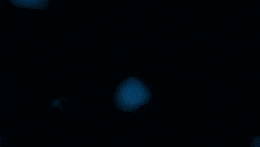 a blue triangle with the letter w on a black background
