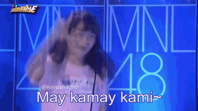 a blurry picture of a girl with the words may kamay kami written in the corner