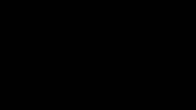 a man wearing a shirt that says wolves is standing in front of a black background
