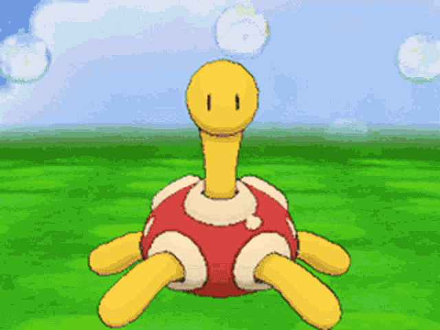 a yellow and red turtle with bubbles coming out of its mouth