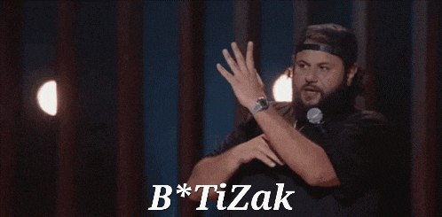 a man with a beard is standing in front of a microphone with his hands in the air and the words b * tizak below him