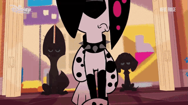 a dalmatian dog wearing a spiked collar is standing in front of a disney logo
