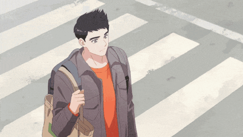 a man with a backpack crosses a street