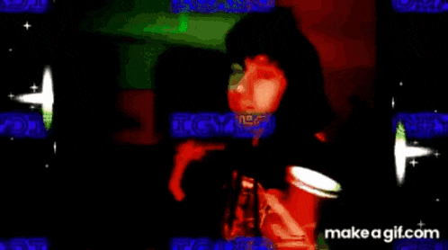 a gif of a woman smoking a cigarette with the words make a gif.com on the bottom