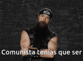 a man with a beard has a bandana on his head and the words " comunista tenias que ser " on the bottom